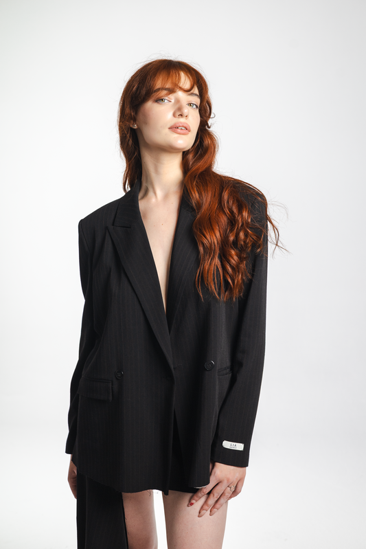 Lana – black double-breasted wool blazer with raw-edge hem, front view