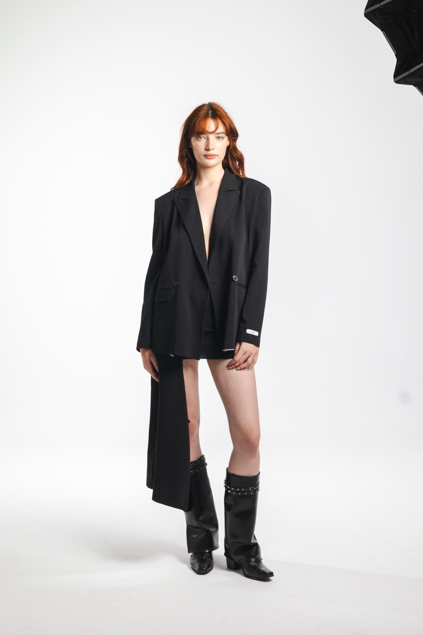 Lana – black double-breasted wool blazer, side view, elegant oversized silhouette