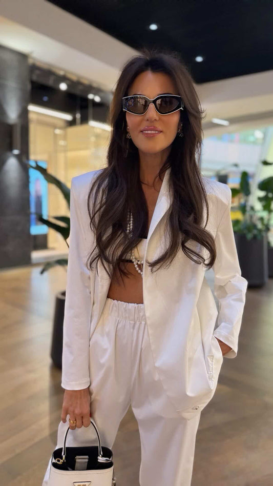 LIA Suit – white cotton satin blazer and trousers set, front view, styled with bag and sunglasses